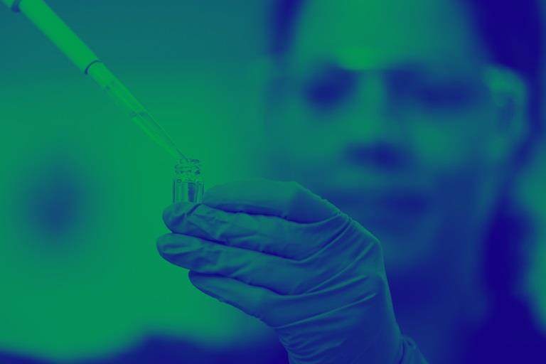 Scientist pipetting an excipient