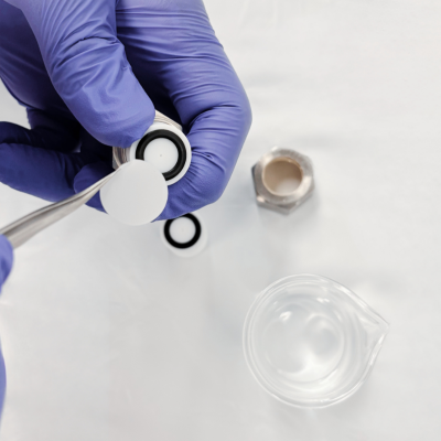 Insert the internal membrane support, with the filter support, into the extruder outer casing with the O-ring facing up.